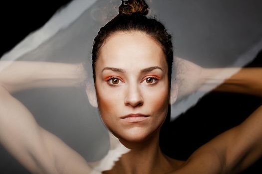 Underwater beauty portrait of a beautiful caucasian girl. Looking at camera.