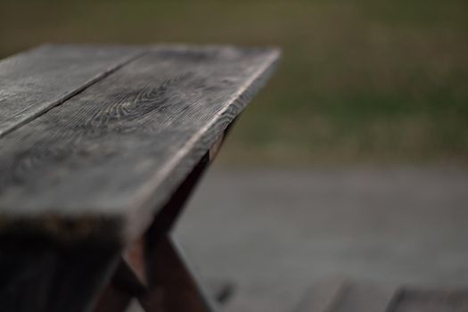 The shabby patio wooden furniture in the garden