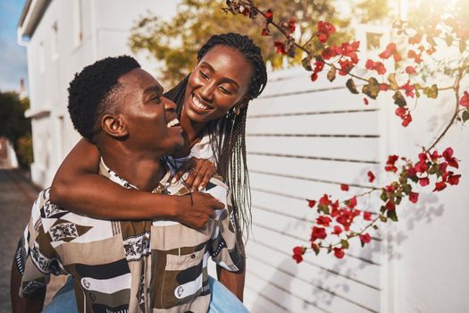 Love, couple and happy with a young man and woman walking together outside with a smile during summer. Dating, affection and romance with a boyfriend and girlfriend enjoying travel and tourism.