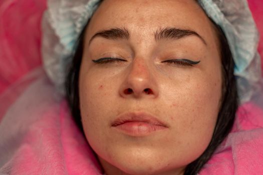 Eyelash extension procedure. Woman eye with long eyelashes. lashes, close up, macro, selective focus