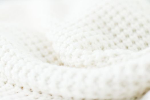 Knitwear, fabric textures and handmade items concept - Warm knitted clothes, soft and white