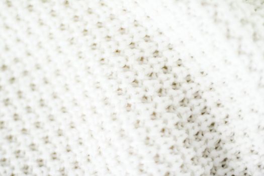 Knitwear, fabric textures and handmade items concept - Warm knitted clothes, soft and white