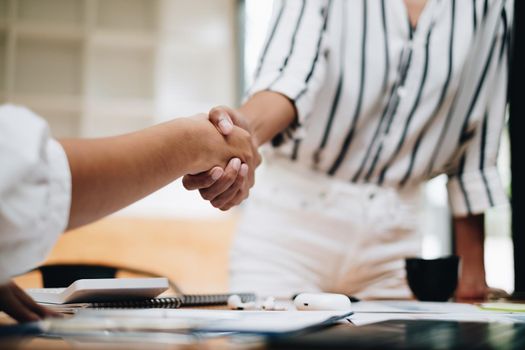 Business woman handshake for the new agreement after sign in agreement contract with work together