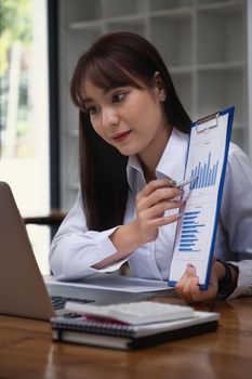 Fund managers researching and analysis Investment stock market meeting with her team by video call