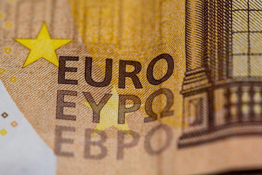 detail of the 50 euro banknote on a wooden surface