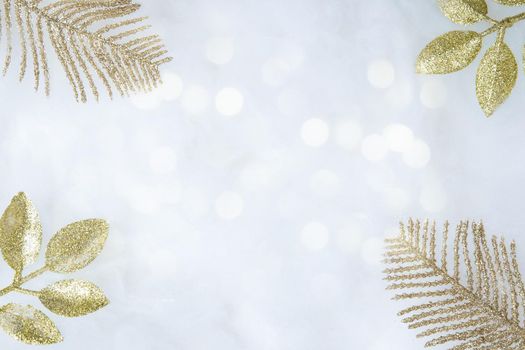 Decorative golden twigs in glitter and bokeh light with copy space Christmas and New year background