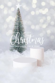 PMerry Christmas greetings and podium or pedestal in the snow with a christmas tree on a bokeh background vertical format