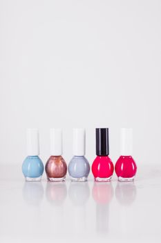 Beauty, make-up and cosmetics concept - Nail polish bottles, manicure and pedicure collection