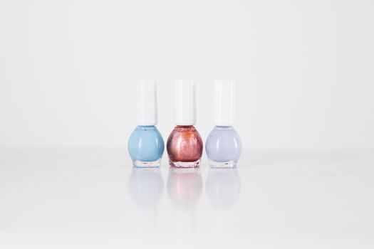 Beauty, make-up and cosmetics concept - Nail polish bottles, manicure and pedicure collection