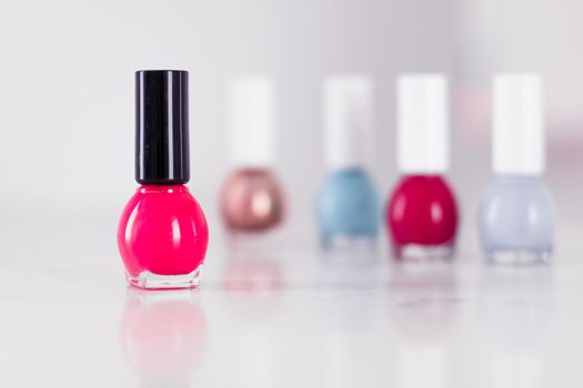 Beauty, make-up and cosmetics concept - Nail polish bottles, manicure and pedicure collection