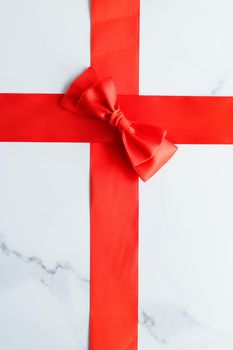 Holiday decor, feminine design and flatlay concept - Red silk ribbon on marble, top view