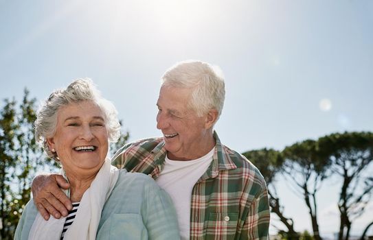 Im still crazy about him. a happy senior couple relaxing together outdoors