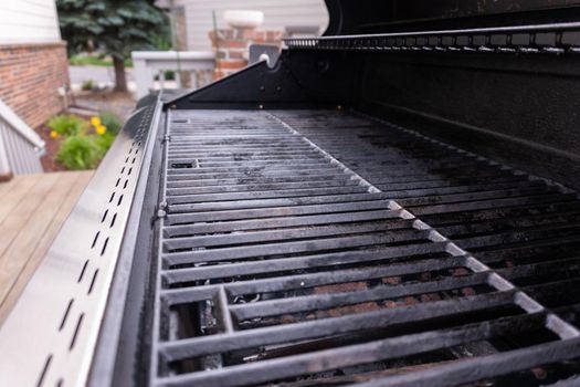 Clean six-burner gas grill ready for summer grilling.