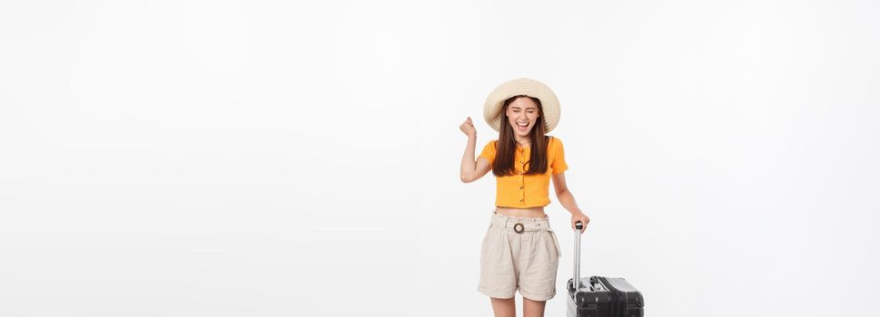 Woman tourist. Full length happy young woman standing with suitcase with exciting gesturing, isolated on white background