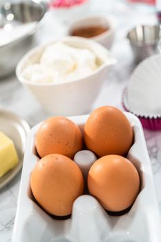 Ingredients to bake red velvet cupcakes.