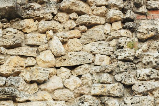 Texture of a stone wall. Old castle stone wall texture background. Stone wall as a background or texture. Part of a stone wall, for background or texture