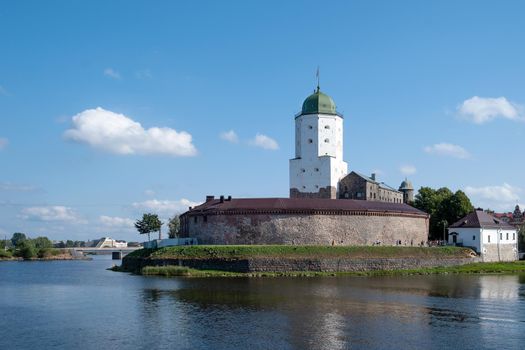 Vyborg, Leningrad region, Russia. - August 27, 2022. View of the medieval knight's castle from the city embankment. Selective focus.