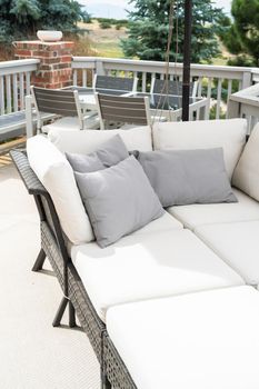 Patio of a luxury single-family home furnished with modern furniture.