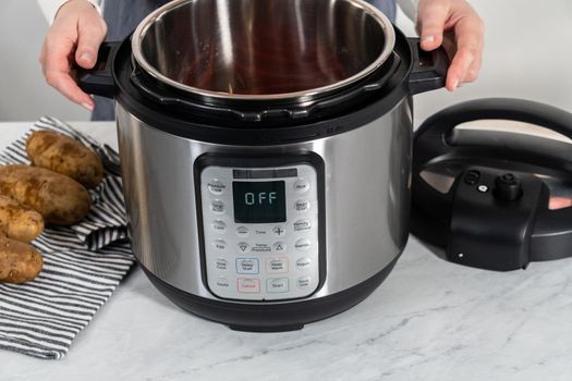 Pressure Cooker Baked Potatoes. Cooking whole potatoes in a pressure cooker to make baked potatoes.