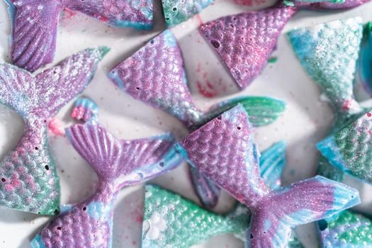 Homemade chocolate mermaid tails covered with glitter dust.