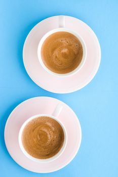 Breakfast, drinks and modern lifestyle concept - Hot aromatic coffee on blue background, flatlay