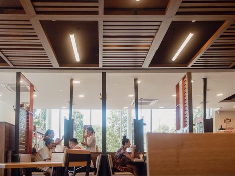 woman orders meal in the electronic touch screen terminal menu in the fastfood restaurant Burger King