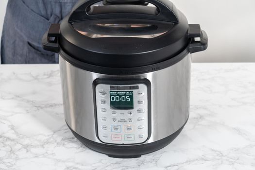 Mashed potatoes. Cooking whole peeled potatoes in a pressure cooker to make mashed potatoes.