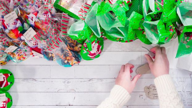 Flat lay. Step by step. Packaging homemade fudge and cookies into a Christmas gift box.