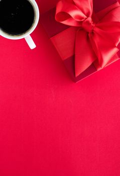 Romantic celebration, lifestyle and birthday present concept - Luxury beauty gift box and coffee on red, flatlay