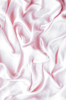 Elegant fabric texture, abstract backdrop and modern pastel colours concept - Pink soft silk waves, flatlay background