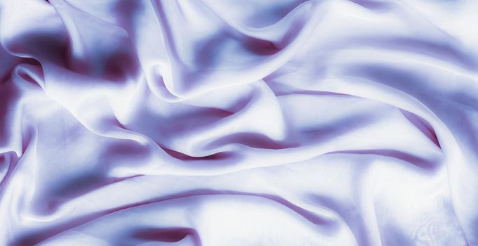 Elegant fabric texture, abstract backdrop and modern pastel colours concept - Purple soft silk waves, flatlay background