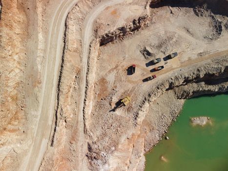 Open pit mine with lake. Quarry fluxes for the metal industry.