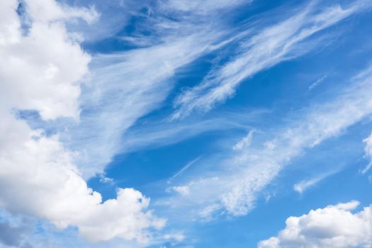 the region of the atmosphere and outer space seen from the earth. White clouds and blue sky