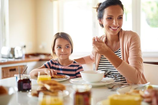 Great days begin with family breakfasts. a family having breakfast together