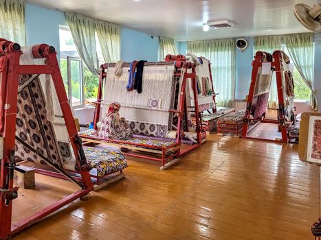 Workshop for the manual production of silk carpets in Central Asia. Uzbekistan.