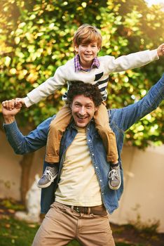 We became friends not just father and son. Portrait of a father and his son playing outdoors