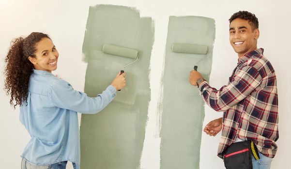 Portrait of happy couple painting room or interior house renovation and home or property design project with smile, white wall background. New home or apartment and happy painter people and DIY paint.
