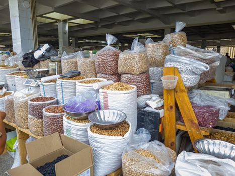 Oriental Bazaar. Almond peeled and unpeeled, nuts sales in market. Dry food, variety almonds in store. Concept of healthy eating, raw product, bazaar, diet, almond theme.