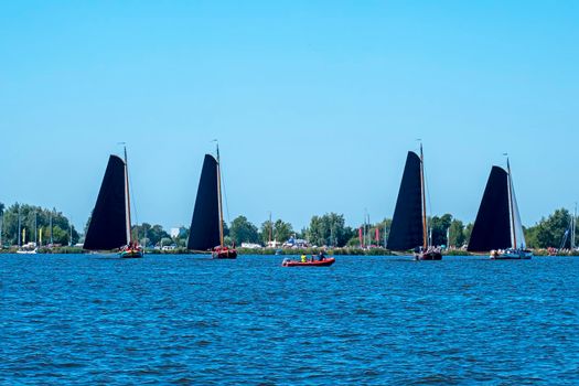 Traditional Frisian wooden sailing ships in a yearly competition in the Netherlands