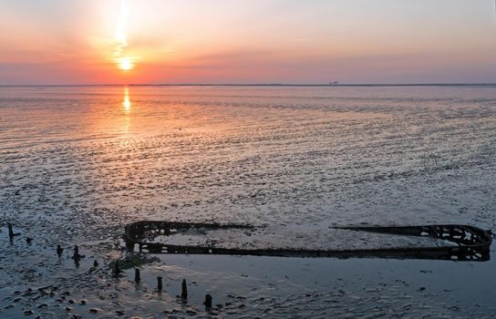 Aerial from an old ship wreck in the Wadden Sea in the Netherlands at sunset