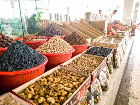 Oriental Bazaar. Almond peeled and unpeeled, nuts sales in market. Dry food, variety almonds in store. Concept of healthy eating, raw product, bazaar, diet, almond theme.