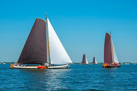 Traditional Frisian wooden sailing ships in a yearly competition in the Netherlands