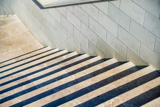 Staircase in the city, black and white pattern on the stairs on a sunny day