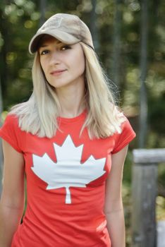 Girl in a T-shirt with a maple leaf