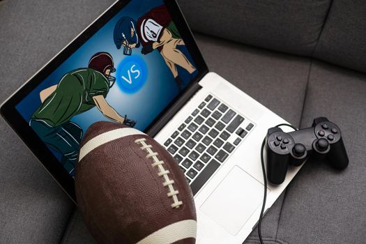 rugby ball, joystick, video game at home.