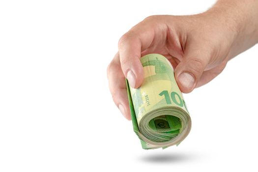 Money in hand isolate on white. The hand holds a roll of 100 euro banknotes. Euro banknotes rolled up in hand isolated on white background. The concept of financial assistance.