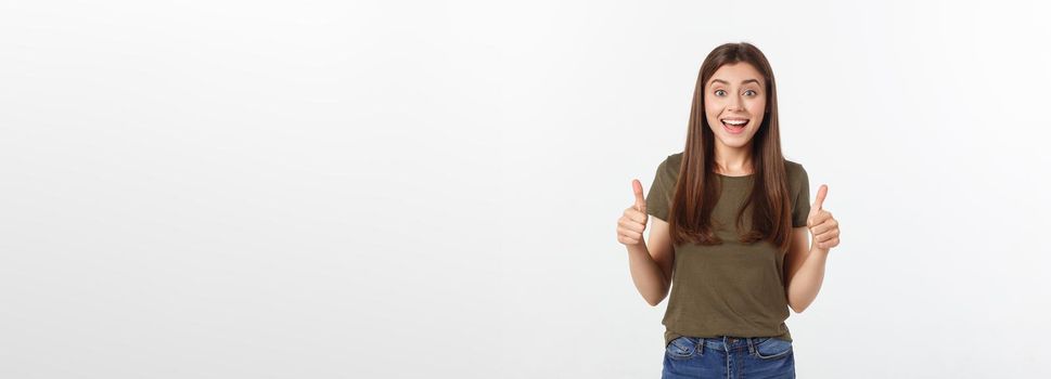 Closeup portrait of a beautiful young woman showing thumbs up sign. Isolate over white background