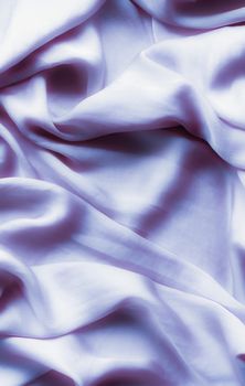 Elegant fabric texture, abstract backdrop and modern pastel colours concept - Purple soft silk waves, flatlay background