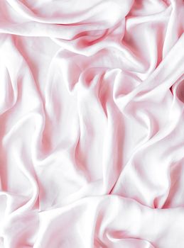 Elegant fabric texture, abstract backdrop and modern pastel colours concept - Pink soft silk waves, flatlay background