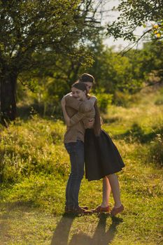 young couple hugging on nature background